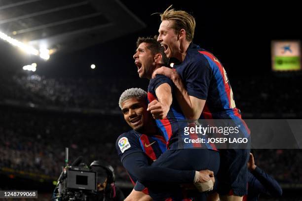 Barcelona's Spanish midfielder Sergi Roberto celebrates with teammates after scoring his team's first goal during the Spanish league football match...