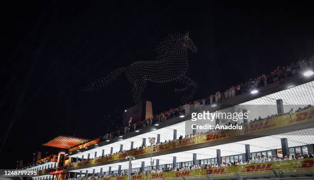 Drone light display is seen over the grid during the F1 Grand Prix of Saudi Arabia at Jeddah Corniche Circuit on March 19, 2023 in Jeddah, Saudi...