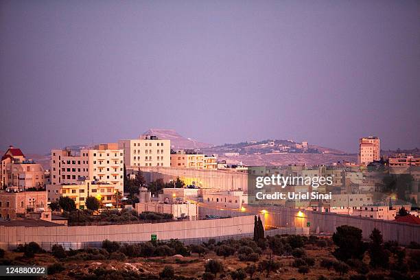 The Israeli separation barrier is seen as as it surrounds the tomb of the biblical Matriarch Rachel on July 13, 2011 in the West Bank town of...