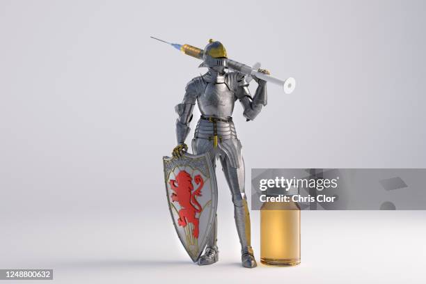 knight figurine with vaccination against coronavirus - armure traditionnelle photos et images de collection