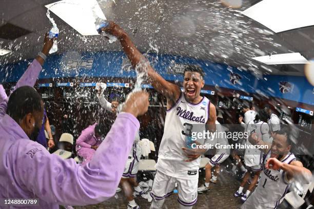 The Kansas State Wildcats celebrate after defeating the Kentucky Wildcats during the second round of the 2023 NCAA Men's Basketball Tournament held...