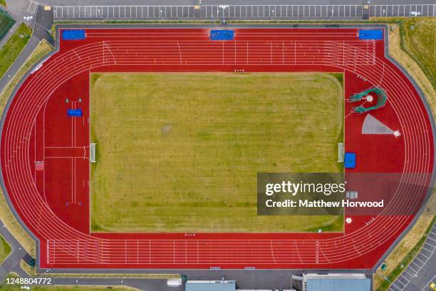 An aerial view of an empty athletics track and field on June 10, 2020 in Aberdare, United Kingdom. The Welsh government has further relaxed COVID-19...