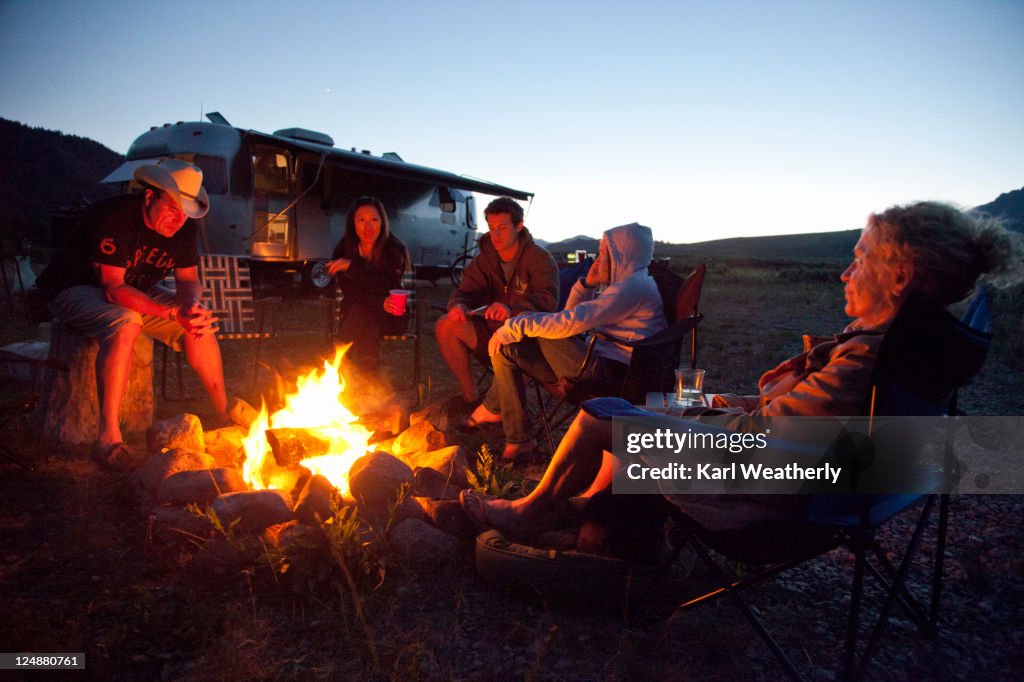 Sitting by campfire