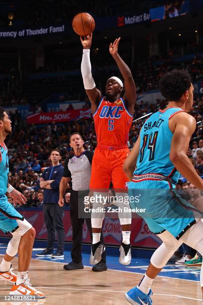 Luguentz Dort of the Oklahoma City Thunder shoots the ball during the game against the Phoenix Suns on March 19, 2023 at Paycom Arena in Oklahoma...