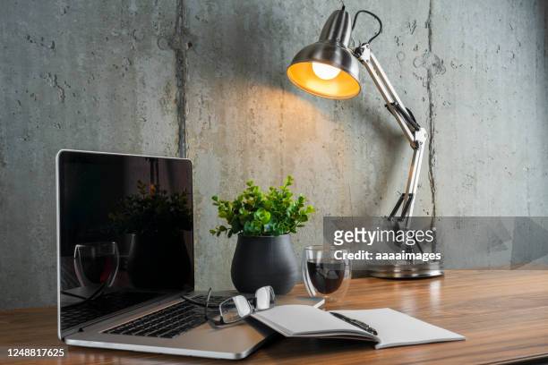 workspace with laptop and notebook - schreibtisch stock-fotos und bilder