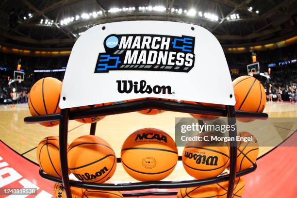 Basketball rack with the March Madness logo sits court-side before St. Mary's Gaels takes on Connecticut Huskies during the the second round of the...