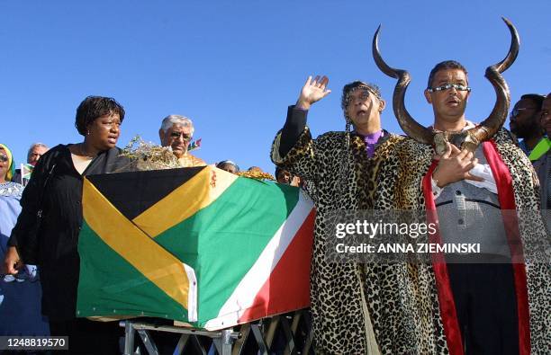 Brigitte Mabandla, deputy minister of Arts and Culture , Khoi-San chief Joseph Little and Elrich Barendse, a member of the Damaqua tribe surround the...