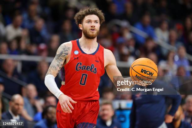 Logan Johnson of the St. Mary's Gaels dribbles during the first half against the Connecticut Huskies during the the second round of the 2023 NCAA...
