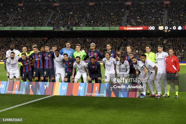 Barcelona and Madrid players pose during the Spanish League football Match between FC Barcelona vs Real Madrid CF at the Camp Nou stadium in...