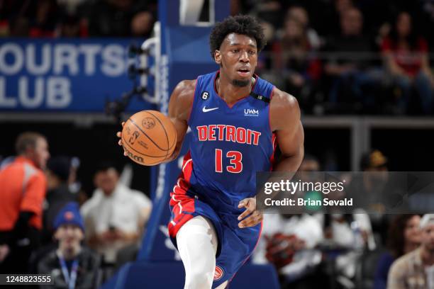 James Wiseman of the Detroit Pistons moves the ball during the game against the Miami Heat on March 19, 2023 at Little Caesars Arena in Detroit,...