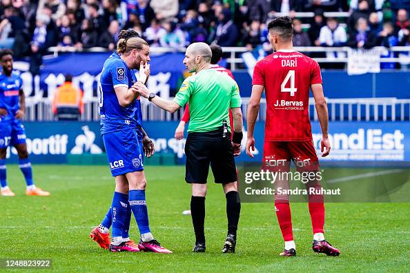 Referee Florent BATTA and Renaud RIPART of Troyes and Achraf DARI of