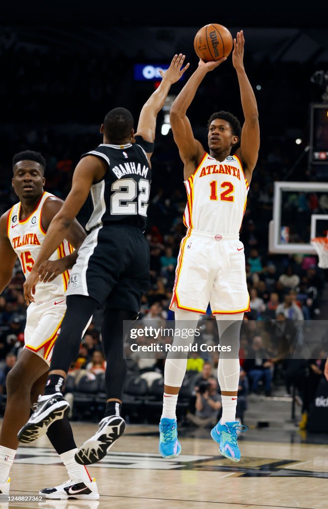 DeAndre Hunter of the Atlanta Hawks shoots against Malaki Branham of DeAndre Hunter of the Atlanta Hawks shoots against Malaki Branham of