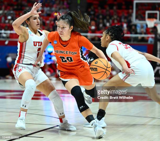 Kaitlyn Chen of the Princeton Tigers drives past Ines Vieira and Teya Sidberry of the Utah Utes in the fourth quarter during the second round of the...