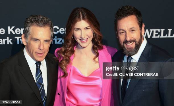 Actor Adam Sandler and his wife Jackie Sandler pose with actor Ben Stiller as they arrive for the 24th Annual Mark Twain Prize For American Humor at...