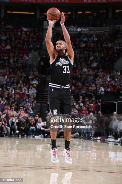 Nicolas Batum of the LA Clippers shoots a three point basket during the game against the Portland Trail Blazers on March 19, 2023 at the Moda Center...