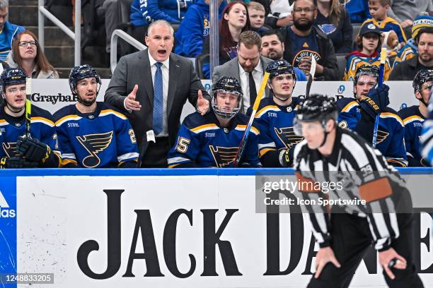 St. Louis Blues head coach yells at referee Brandon Blandina wanting more explanation on the penalty calls on the ice during a game between the...