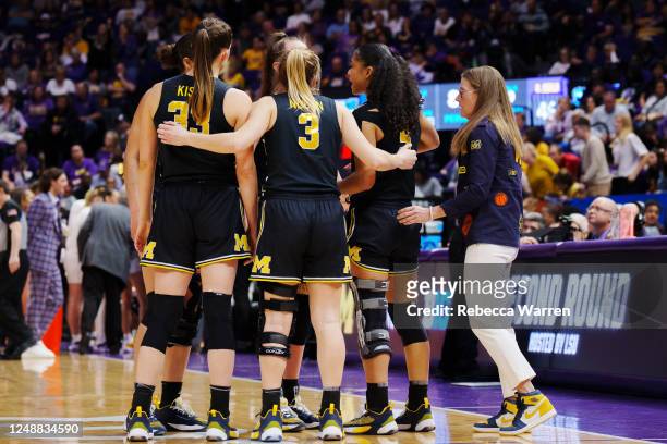 Michigan Wolverines players huddle during the fourth quarter against the LSU Lady Tigers in the second round of the 2023 NCAA Women's Basketball...