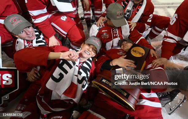 Sophie Shirley of the Wisconsin Badgers celebrates as Cami Kronish hugs the National Championship trophy following a 1-0 win over the Ohio State...