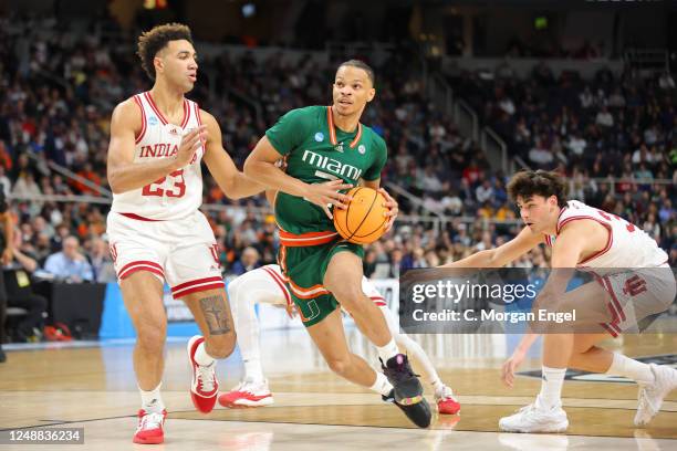 Isaiah Wong of the Miami Hurricanes drives to the basket against Trayce Jackson-Davis of the Indiana Hoosiers during the first half during the second...