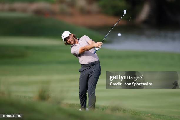 Tommy Fleetwood of England hits his second shot from the rough at the 14th hole during the final round of THE PLAYERS Championship on THE PLAYERS...