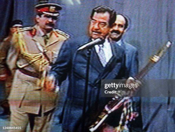 Sadam Rashka A grab from Iraqi TV shows Iraqi President Saddam Hussein displaying ...