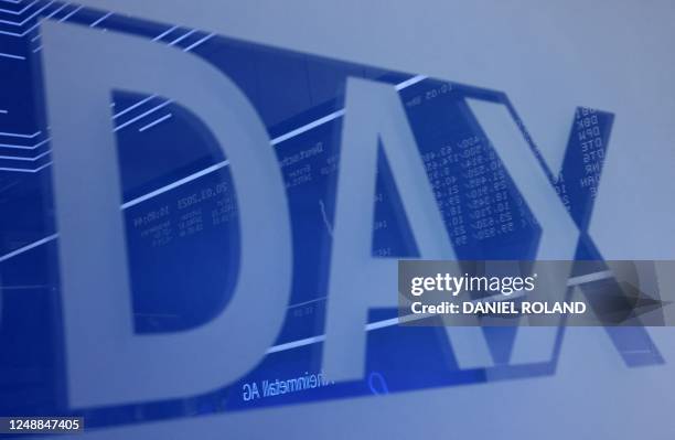 The logo of German share index DAX is seen on a glass screen at the Frankfurt Stock Exchange in Frankfurt am Main, western Germany, where German arms...