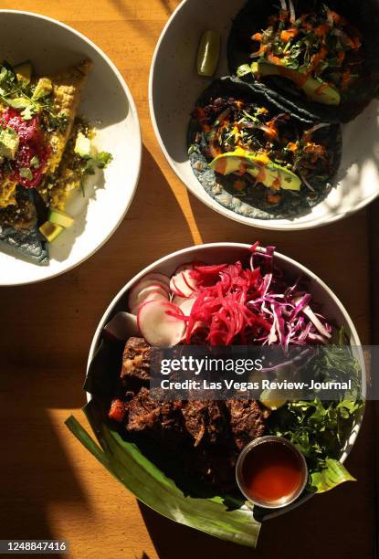 Black bean tetela, clockwise from left, mushroom tacos, and barbacoa from Milpa, a Mexican restaurant in the southwest Las Vegas valley, Thursday,...