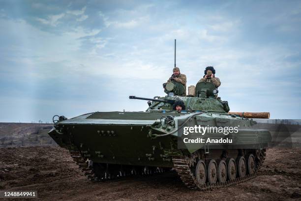 Ukrainian servicemen ride their tank at a firing range, Donetsk Oblast, Ukraine, March 15, 2023.