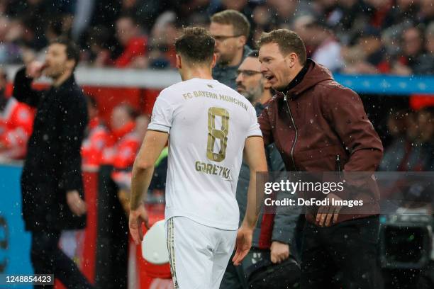 Leon Goretzka of Bayern Muenchen and Julian Nagelsmann of Bayern Muenchen in conversation during the Bundesliga match between Bayer 04 Leverkusen and...