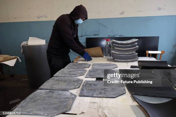 Worker manufactures a ballistic plate at the Ukrainian Spring Center, Kharkiv, northeastern Ukraine.