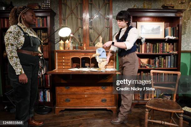 Comfort Fabian as Beatrix Potter watches as Kate Rowsell animates a model Peter Rabbit during the photocall for "The Peter Rabbit™ Easter Adventure",...