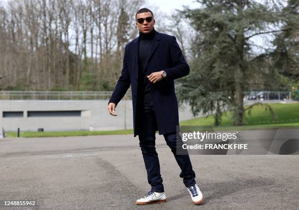 France's forward Kylian Mbappe arrives in Clairefontaine-en-Yvelines on March 20, 2023 as part of the team's preparation for upcoming UEFA Euro 2024...