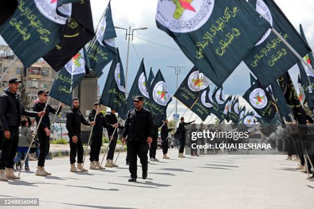 Members of Al-Quds Brigade parade during the funeral of Ali Ramzi al-Aswad, one of the commanders of Palestinian militant group Islamic Jihad, in the...