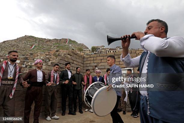 Iraqi Kurds celebrate their new year Nowruz, in the town of Akra in Iraq's northern autonomous Kurdish region, on March 20, 2023.