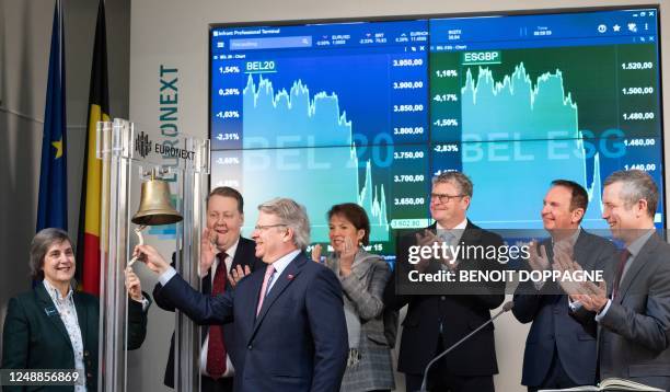 Melexis chairwoman Francoise Chombar and Barco chairman Frank Donck ring the bell during the bell ceremony of the Euronext Brussels Stock Exchange in...