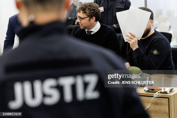 Defendant Rabieh R. Sits at his place in the courtroom of the Higher Regional Court in Dresden, eastern Germany on March 20, 2023 prior to a hearing...