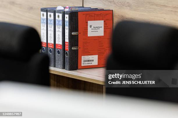 Court files are seen in a courtroom at the Higher Regional Court in Dresden, eastern Germany on March 20, 2023 prior to a hearing in the trial over a...