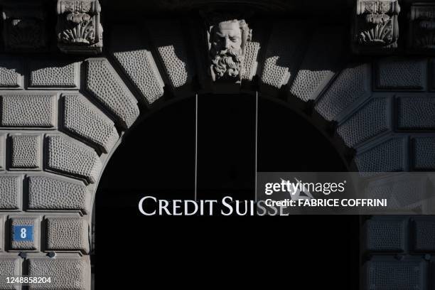 The sign and logo of Credit Suisse bank is seen at their headquarters in Zurich on March 20, 2023. - Swiss banking giant UBS agreed to take over...