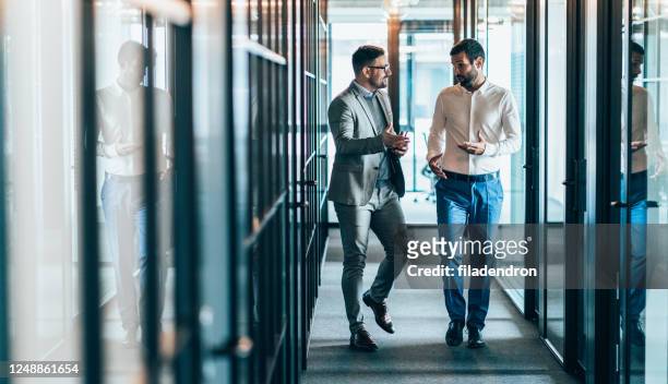business partners in discussion - partnership stock pictures, royalty-free photos & images