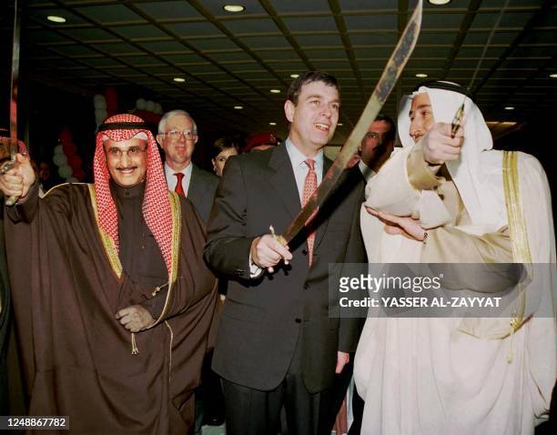 Britain's Prince Andrew , accompanied by Kuwait's governor of Farwaniya province Sheikh Ibrahim Duaij al-Sabah and the director of Kuwait's crown...