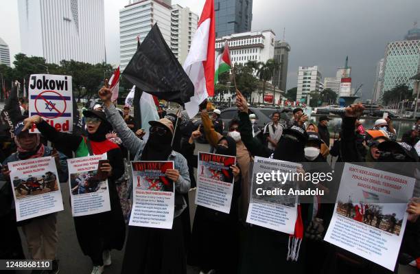 Hundred of protesters hold a protest near the State Palace in Jakarta, Indonesia on March 20, 2023. The protesters demanded the Indonesian government...
