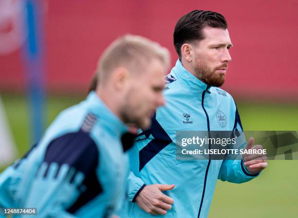 Denmark's Pierre-Emile Hoejbjerg takes part in a training session in Helsingoer, Denmark, on March 20 prior the upcoming UEFA Euro 2024 football...