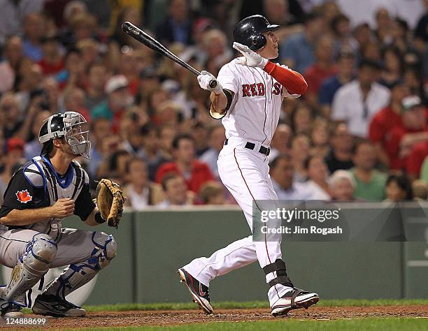 Jacoby Ellsbury of the Boston Red Sox connects for a home run in the fourth inning against the Toronto Blue Jays at Fenway Park September 13, 2011 in...