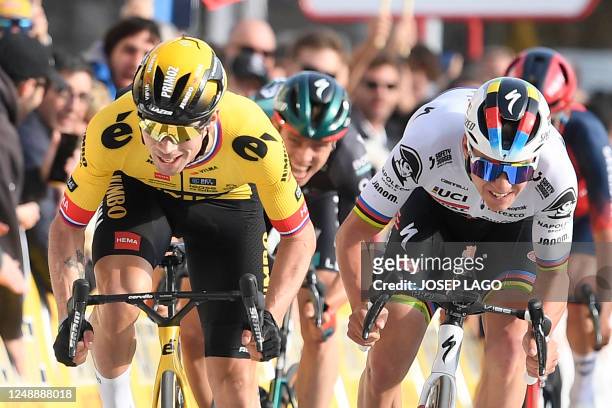 Team Jumbo's Slovenian rider Primoz Roglic crosses the finish line first ahead of Quick-Step Belgian rider Remco Evenepoel during the 1st stage of...