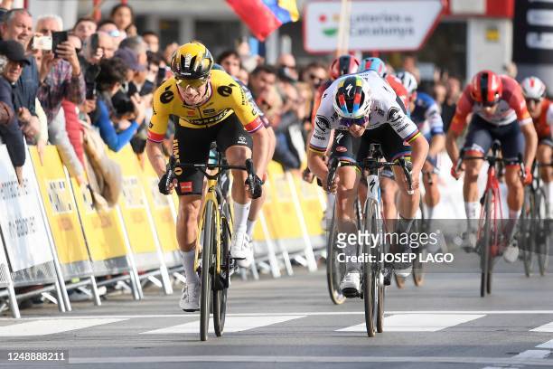 Team Jumbo's Slovenian rider Primoz Roglic ahead of Quick-Step Belgian rider Remco Evenepoel crosses the finish line first during the 1st stage of...