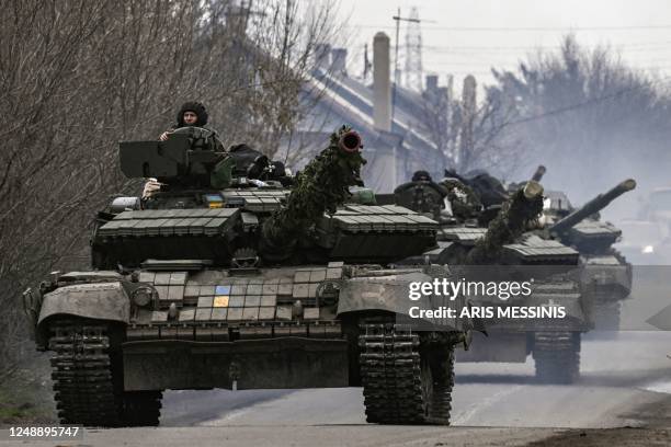 Ukrainian T64 tanks move towards Bakhmut direction, in Donetsk Oblast region, on March 20, 2023. - The head of Russia's Wagner mercenary group said...