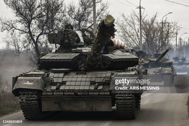 Ukrainian T64 tanks move towards Bakhmut direction, in Donetsk Oblast region, on March 20, 2023. - The head of Russia's Wagner mercenary group said...