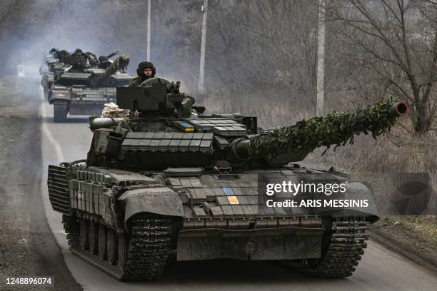 Ukrainian T64 tanks move towards Bakhmut direction, in Donetsk Oblast region, on March 20, 2023. - The head of Russia's Wagner mercenary group said...