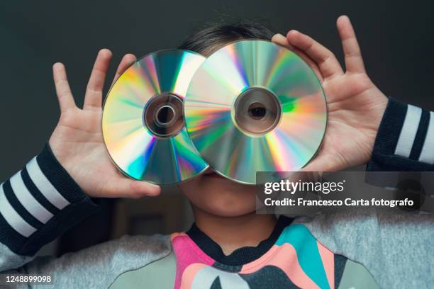 looking through compact disc - kids rom stock pictures, royalty-free photos & images