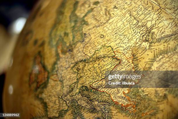 antique earth globe close-up - mappamondo stockfoto's en -beelden